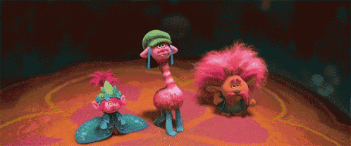 a group of trolls standing next to each other on a table