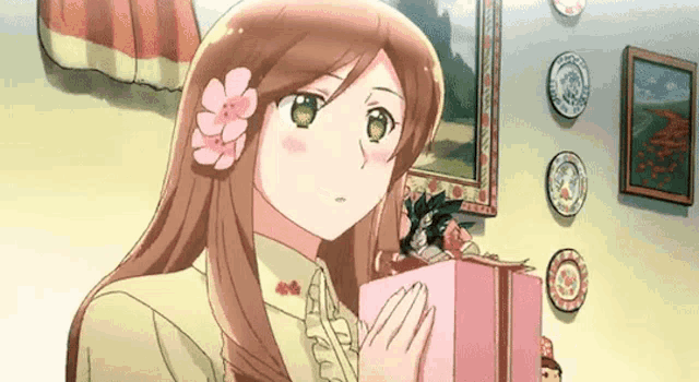 a girl with a flower in her hair is holding a gift box in her hands