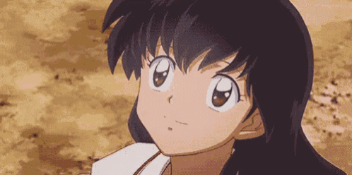 a close up of a girl 's face in a cartoon looking up .