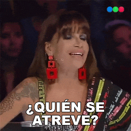 a woman with a tattoo on her arm is smiling and says quien se atreve
