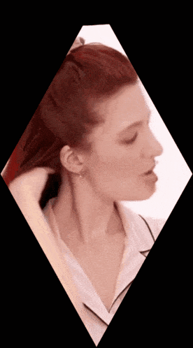 a woman with red hair is in a diamond shaped frame