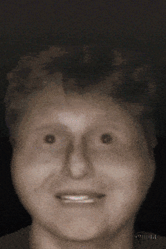 a close up of a person 's face with a blurred background and a few numbers on it
