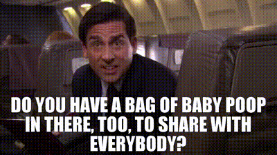 a man is sitting on an airplane with a bag of baby poop in there .