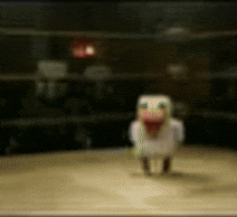 a blurred image of a stuffed animal with a red nose