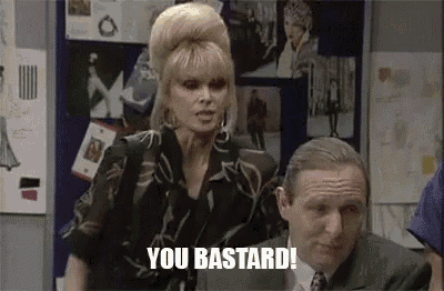 a woman is standing next to a man in a suit and tie and saying `` you bastard ! ''