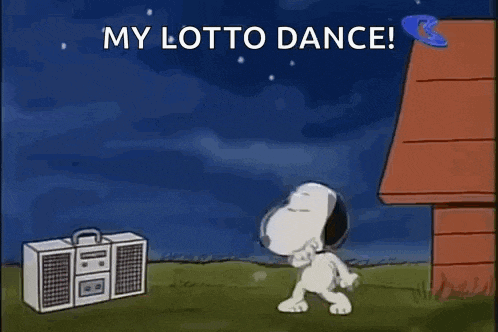 snoopy is dancing in front of a boombox in a field .