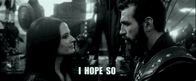 a man and a woman are looking at each other and the woman is saying i hope so