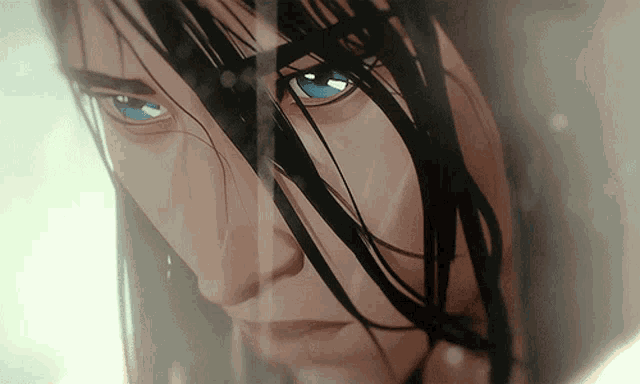 a close up of a woman 's face with long hair and blue eyes