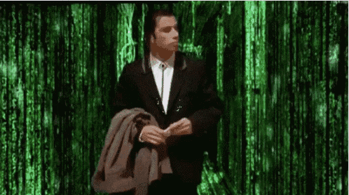 a man in a suit and tie is standing in front of a green screen .