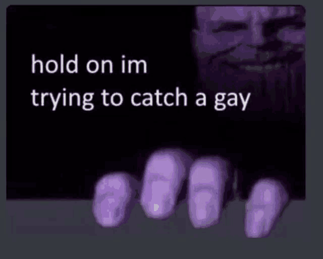 a picture of a hand with purple nails and the words `` hold on im trying to catch a gay '' written on it .