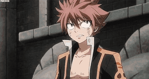 natsu from fairy tail is standing in front of a brick wall in a black and orange jacket .