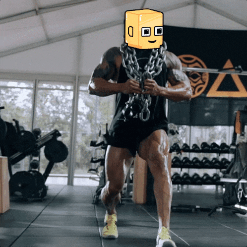 a man in a gym with a box on his face