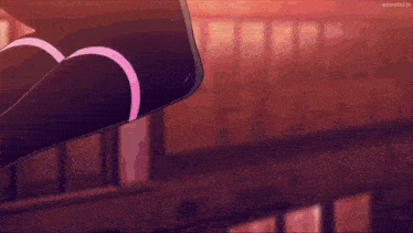 a person wearing black knee high socks with pink stripes on them