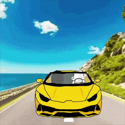 a yellow sports car is driving down a road near the ocean