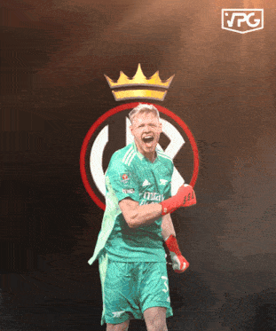 a soccer player in a green jersey with fly emirates on it