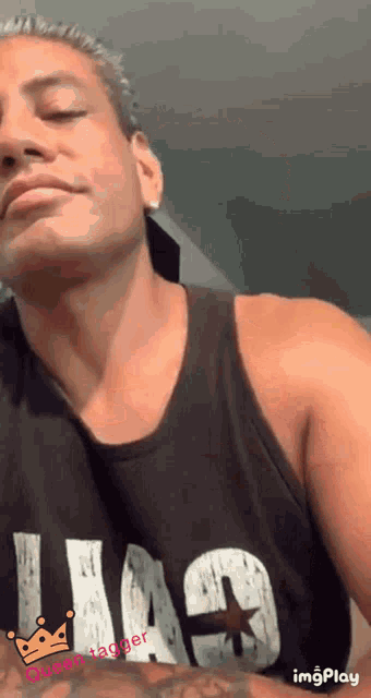 a man wearing a black tank top that says chicago