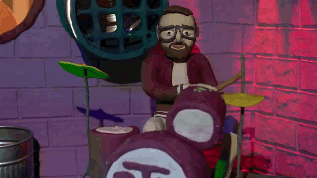 a man with glasses is playing drums in a room