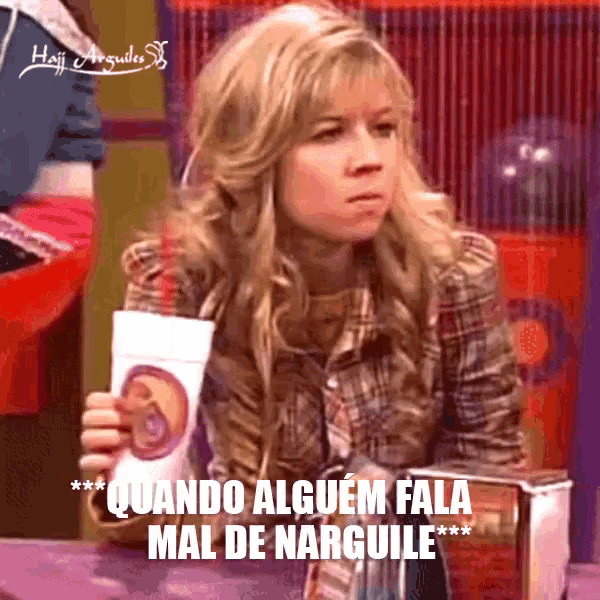 a woman holding a cup that says " quando alguem fala mal de narguile " on it