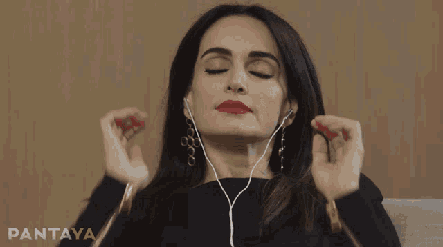 a woman wearing earbuds with the word pantaya on the bottom right