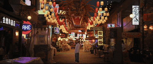 a man stands in front of a store that says ahc