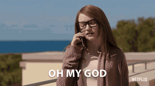 a woman talking on a cell phone with the words oh my god written below her