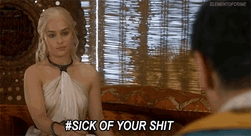 a woman sitting on a couch says #sick of your shit to a man
