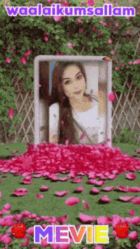 a picture of a woman in a frame surrounded by pink flowers