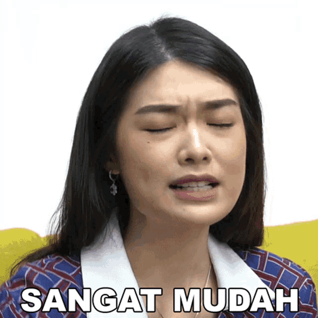 a woman with her eyes closed and the words sangat mudah written on her face