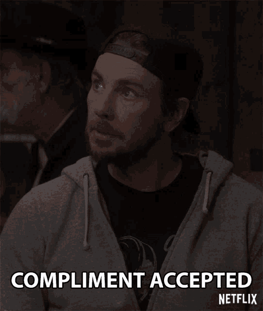 a man wearing a hat says compliment accepted