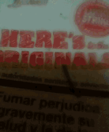 a close up of a sign that says here 's the original