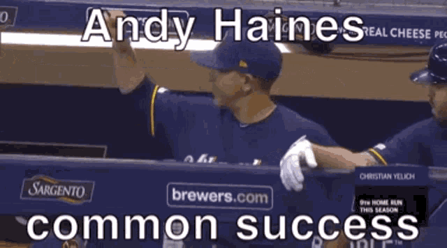 a baseball player named andy haines is standing in a dugout