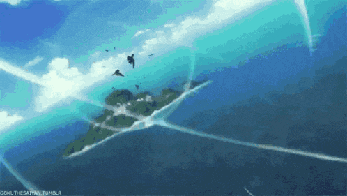 a group of birds are flying over a small island in the middle of the ocean