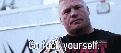 a man in a black shirt is holding a wrestling belt and saying go fuck yourself