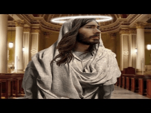 jesus is wearing a white robe with a halo around his head