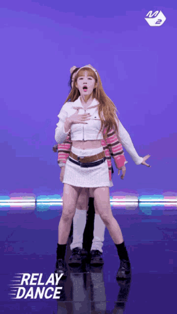 a girl in a white skirt is dancing with the words relay dance below her
