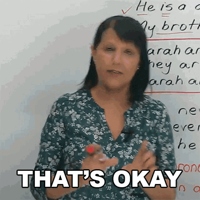a woman in front of a whiteboard says that 's okay
