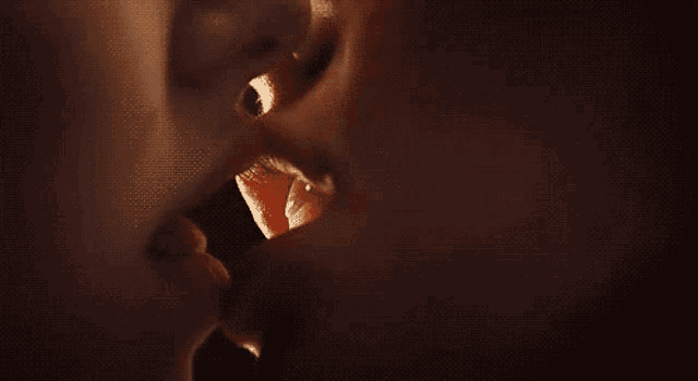 a close up of a person 's mouth with teeth .