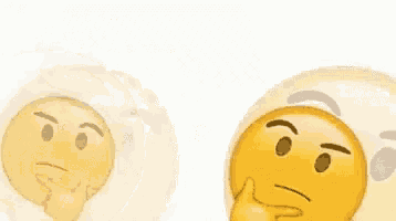 two thinking emojis are sitting next to each other on a white surface .
