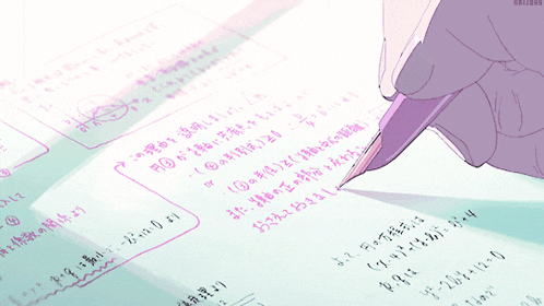 someone is writing on a piece of paper with chinese writing on it