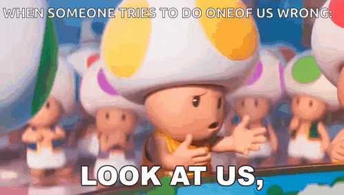 a group of toads are standing in front of a mirror with the words `` look at us '' written on it .