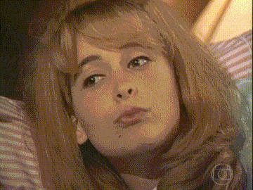 a close up of a woman 's face with a camera in the corner .