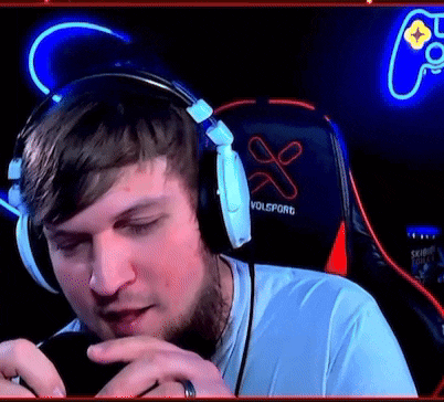 a man wearing headphones and a volsporg chair