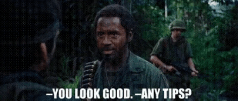 a man in a military uniform is talking to another man in the woods and says `` you look good any tips ? ''