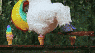a unicorn with ice cream cones on its legs is standing on a railing .