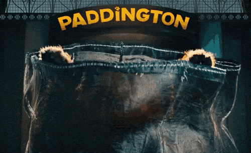 a sign that says paddington on it with a person in it