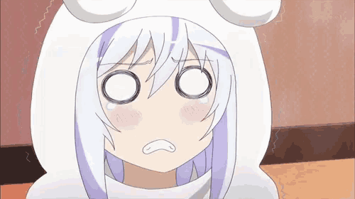 a girl with purple hair is wearing a white hoodie with ears and making a surprised face .