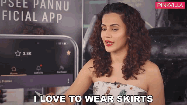 a woman says i love to wear skirts in front of a pinkvilla logo