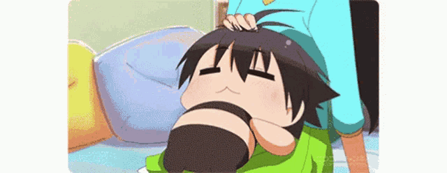 a cartoon character is laying on a bed with his head on someone 's head .