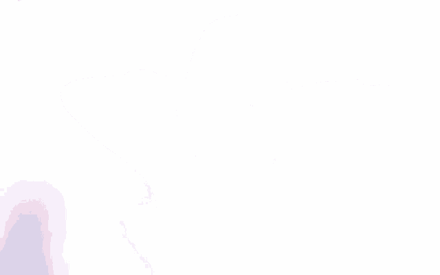a woman in a brown sweater is standing in front of a white background .