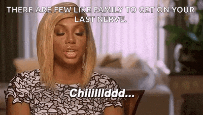 a woman is sitting at a table with her eyes closed and saying `` there are few like family to get on your last nerve . ``